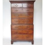 A late Georgian oak chest on a stand,