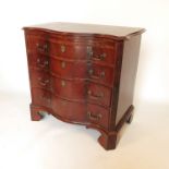 A Georgian mahogany serpentine fronted chest,