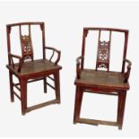 A pair of oriental chairs, in the Chinese style, with floral pierced central splat,