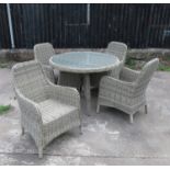 A rattan conservatory suite, comprising a circular table and four matching armchairs,