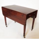 A 19th century mahogany Pembroke table, fitted with a frieze drawer and two dummy drawers,