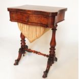 A 19th century walnut foldover work table, the foldover top inlaid with a games board,