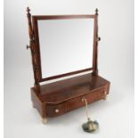 A 19th century mahogany dressing table mirror, the rectangular plate raised on turned side supports,