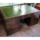 An antique mahogany estate partners desk, fitted with an arrangement of drawers to each side,