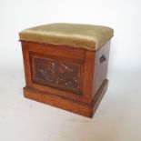 A 19th century oak and pollard oak box, with rising lid and carved front panel,