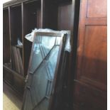 An astragal glazed bookcase, with four sections over cupboards,