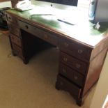A 19th century mahogany pedestal desk, with fitted drawers around the kneehole,
