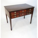 A 19th century mahogany dressing table, fitted with six drawers,