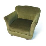 A 1920's child's armchair, in green velvet,