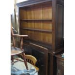 An oak dresser, having sliding panels to the top,