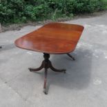 A 19th century Regency style mahogany twin pillared table,