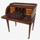 A 19th century mahogany tambour front desk, with satinwood cross banding,