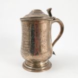 A 19th century silver covered tankard, of baluster form,