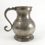 A large French pewter tankard, of baluster form, height 8.