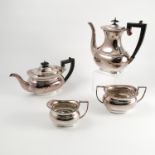 A four piece silver tea set, comprising tea pot, coffee pot, milk jug and sugar bowl,
