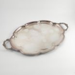 A silver two handled tray, of shaped oval form with a pair of handles, Sheffield 1968, weight 93oz,