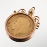 A 1911 gold sovereign, in a pendant mount Condition report: Weight 9.