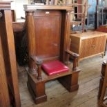 A mahogany Masonic Lodge chair, being for one of the three officers of the lodge, with panel back,