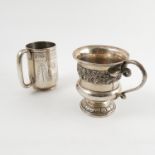 A silver christening mug, with band of grape vine decoration,