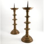 A pair of antique turned brass picket candlesticks, possibly Dutch,