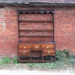 An oak pot board dresser, with open Delft rack over,