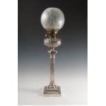 A silver plated and glass oil lamp, with etched shade,