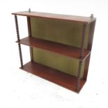 A set of 19th century mahogany shelves, divided by bobbin turned columns,