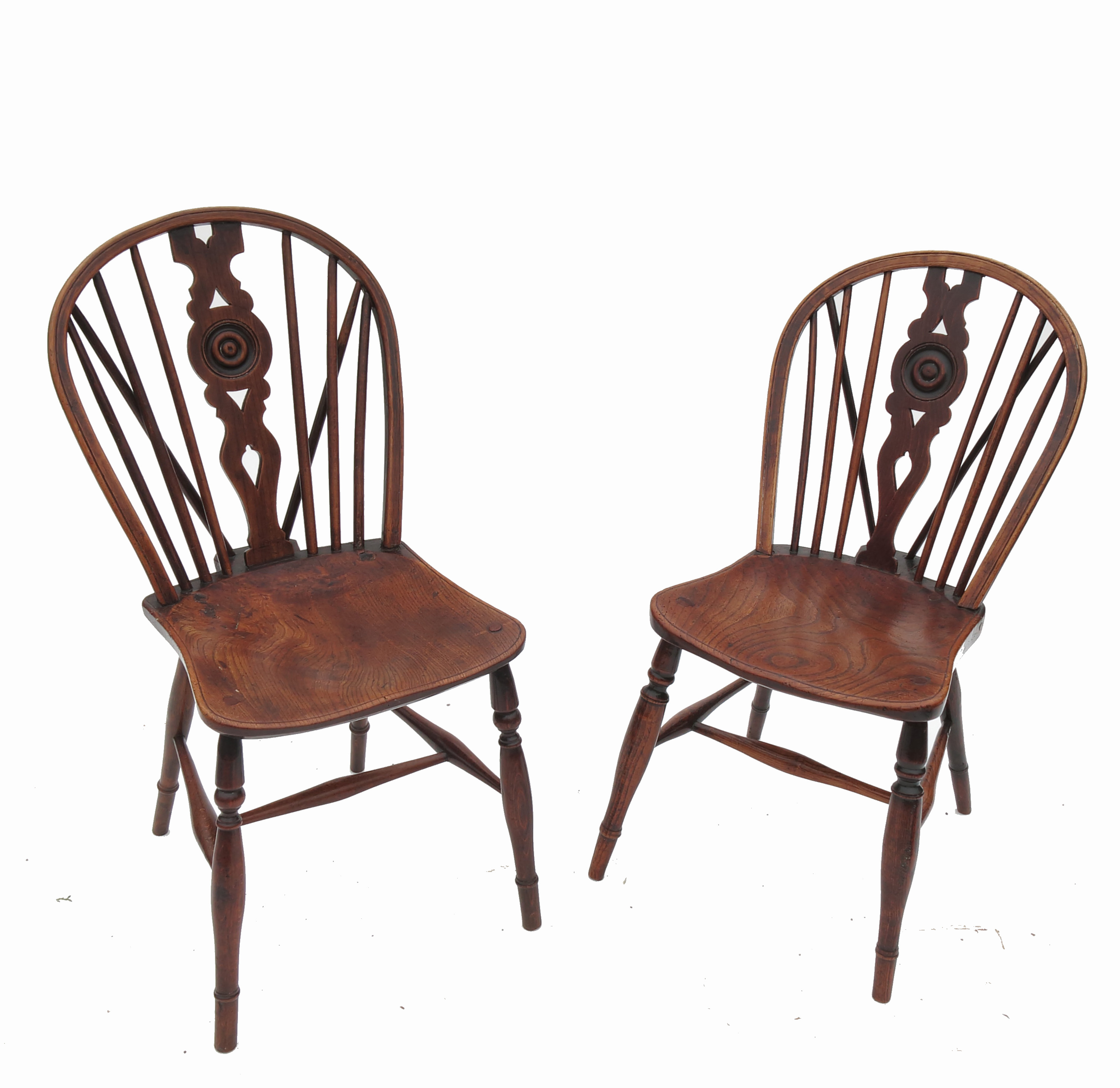 A set of six Windsor dining chairs, with bell push wheel back within a pierced vase splat,