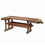 A vintage workbench of rectangular form,