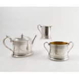 A Scottish silver three piece tea set, with bead edge,