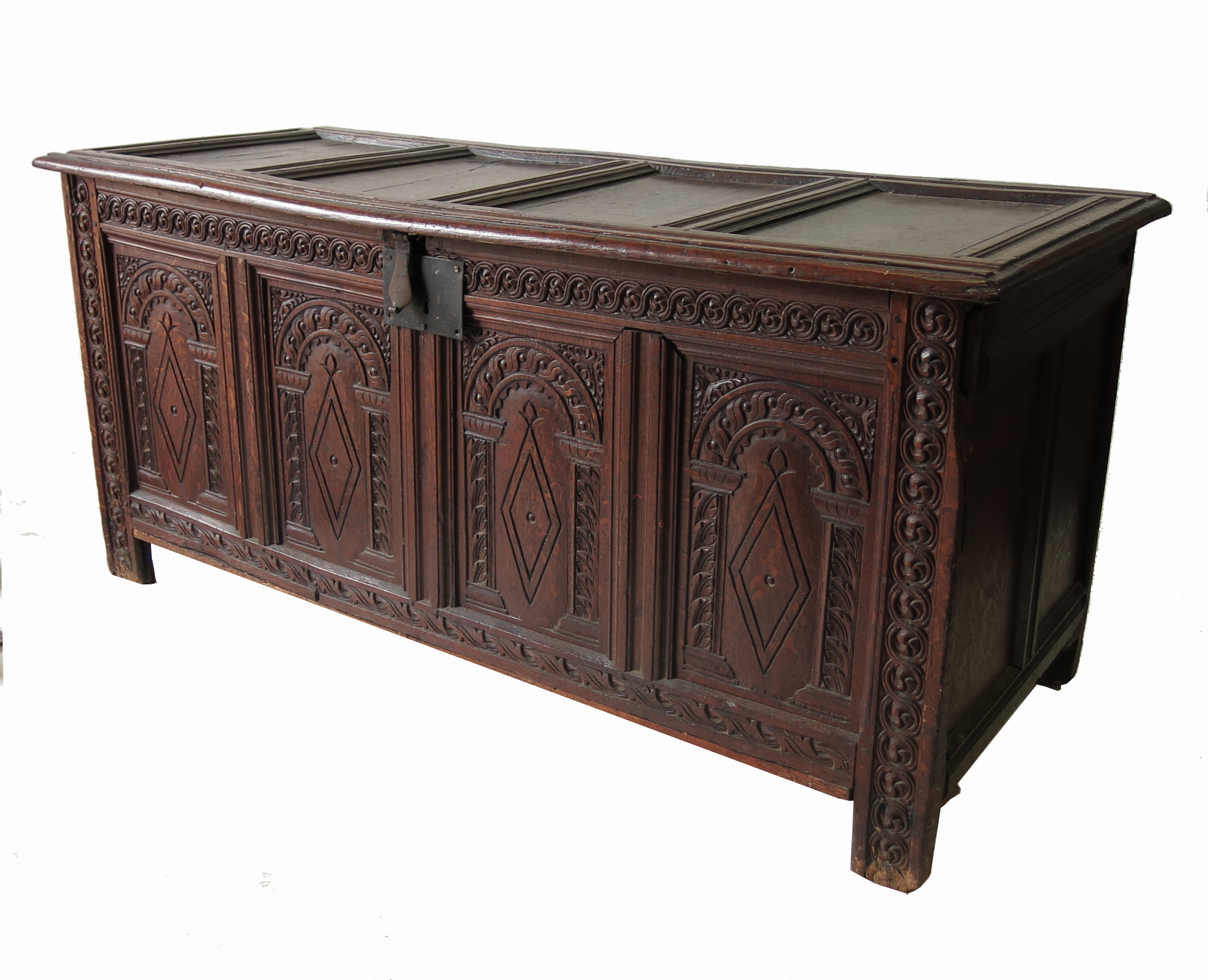 An 18th century oak coffer, with four panelled rising lid over four carved panels to the front,