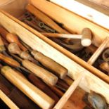 A late 19th century oak tool box, fitted with a large variety of wood working and other tools,