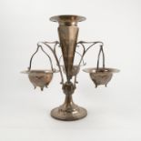 A silver centre piece, the central trumpet having three pierced arms supporting three baskets,