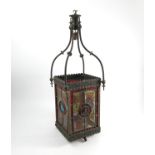 A Victorian lantern, with four coloured leaded light etched glass panels within a hanging frame,