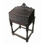 An Antique bible box, raised on a stand, with carved decoration, width 26ins,