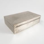 A silver cigarette box, of rectangular form, decorated to the top and sides, London 1969, 6.