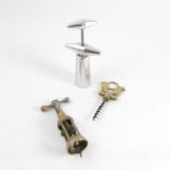 An antique brass four pillar mechanical corkscrew, traces of plating,