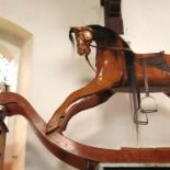 A 20th century solid wood rocking horse