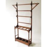 An Edwardian oak hall stand, with hooks, rails and four stick division, width 53ins,