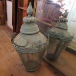 A metal and glass lantern, of circular tapering form, together with wall bracket,