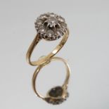 A nine stone diamond cluster ring, stamped '18ct Plat',