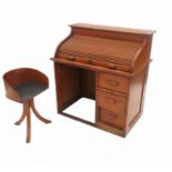 A 20th century child's beech tambour fronted desk,