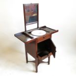 A George III mahogany wash stand, with open out top revealing apertures and rising mirror,