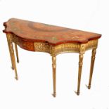 A Sheraton style satinwood console table, with triple serpentine front,