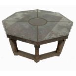 An octagonal copper topped low table, with studded top and sides,