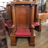 A mahogany Masonic Lodge chair, being for one of the three officers of the lodge, with panel back,