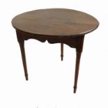 A 19th century circular cricket table, raised on three turned legs,