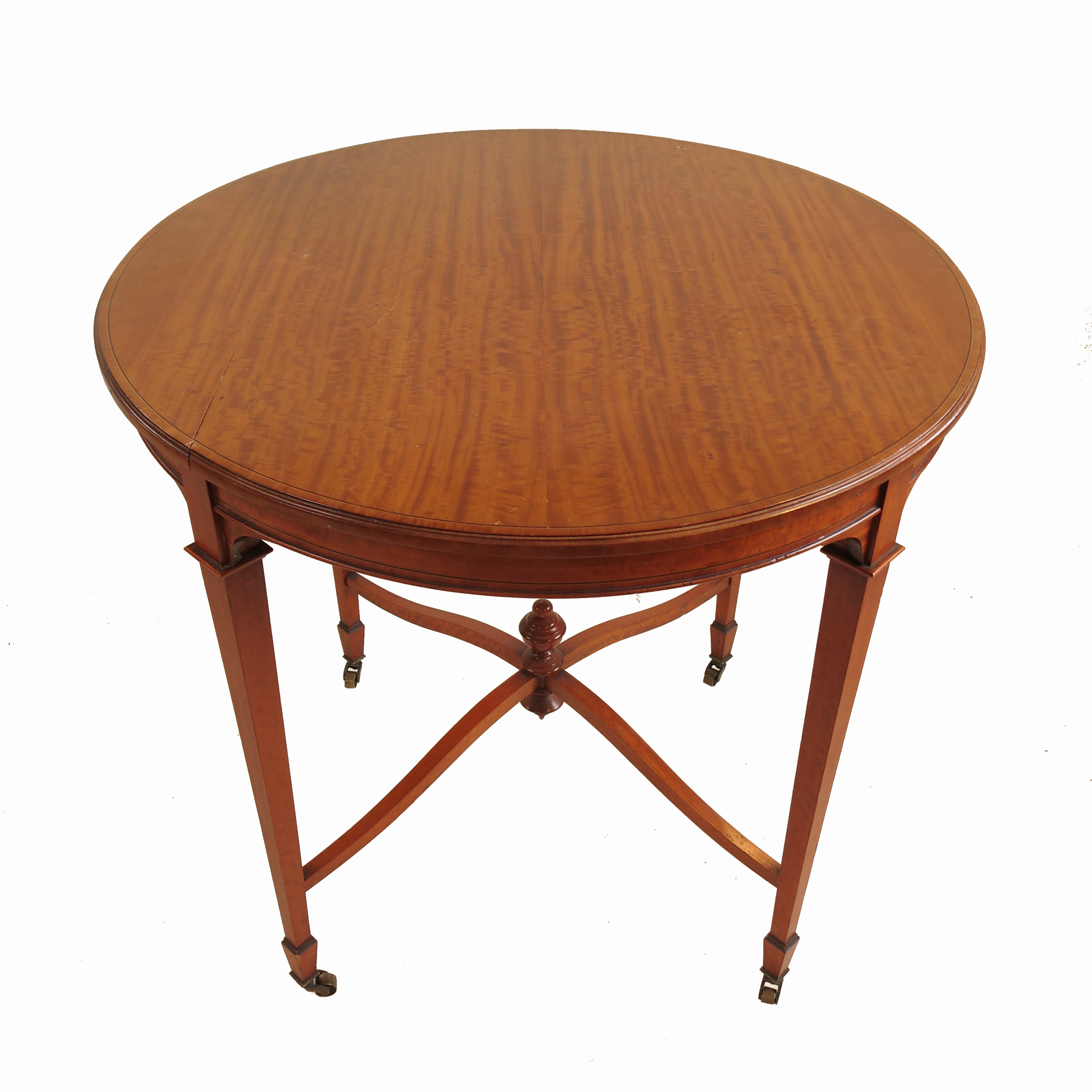 An Edwardian circular satinwood centre table, with ebonised and cross banded border,