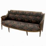 A 19th century gilt sofa, with bow front raised on four reeded legs,