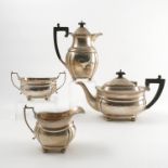 A silver four piece tea set, with gadrooned edge, raised on ball feet, Sheffield 1938,